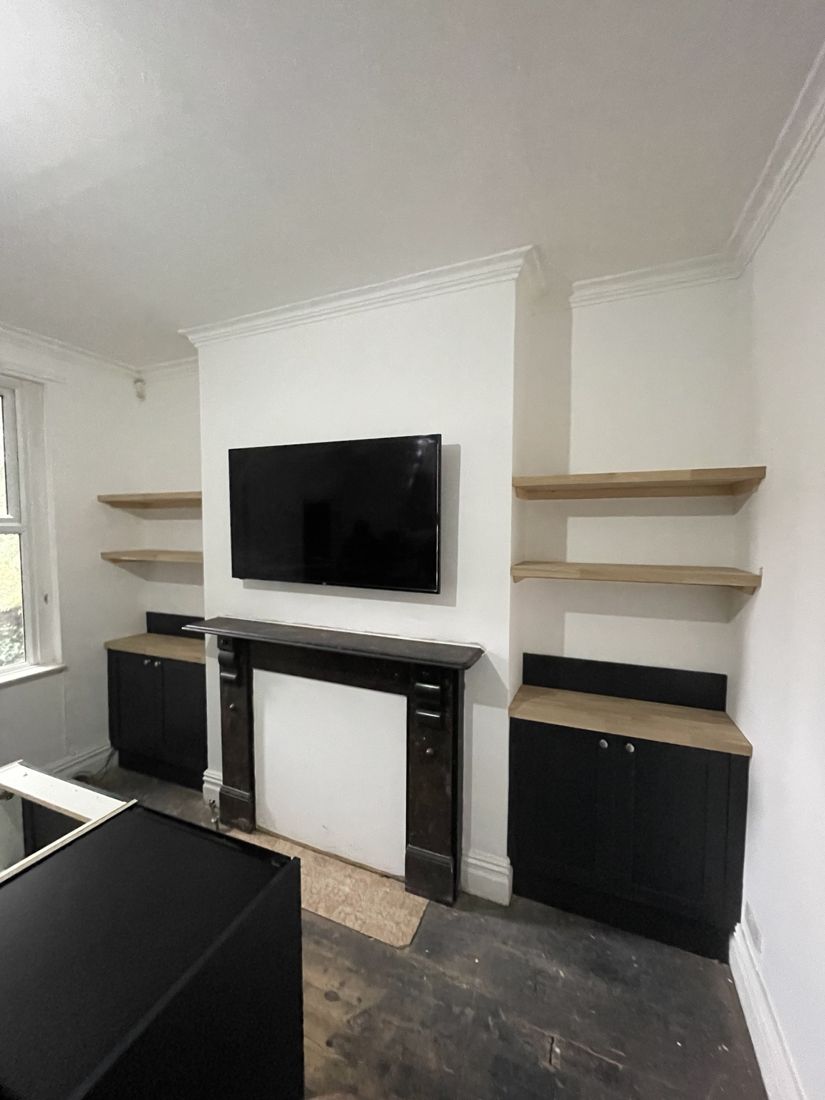 Fitted wardrobes beneath a sloping ceiling
